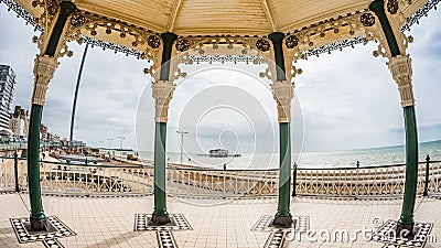 Fish eye view of the Victorian bandstand and the remains of the destroyed West pier in Brighton and Hove Stock Photo