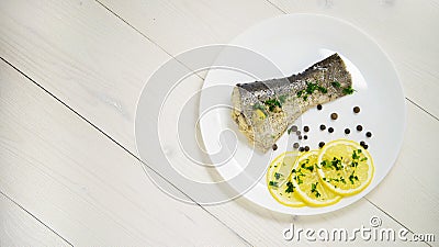 Fish with fresh herbs and lemon steamed black pepper Stock Photo