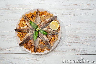 Fish Kabsa - mixed rice dishes that originates in Yemen. Middle eastern food. Stock Photo