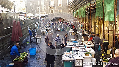 Local people and tourists buying fresh fish on a fish market Editorial Stock Photo