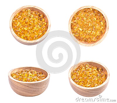 Fish oil capsule, Omega 3-6-9 fish oil yellow soft gels capsules, Sacha inchi oil, Yellow oil pills in wood cup on white Stock Photo