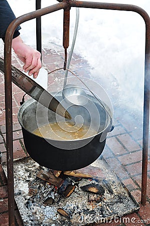 Fish soup on fire Stock Photo