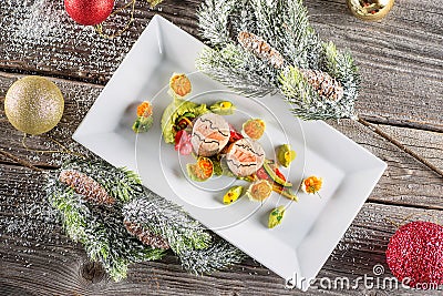 Fish starter food on white plate with christmas decoration. product photography and modern gastronomy Stock Photo