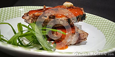 Fish steak with barbeque sauce Stock Photo