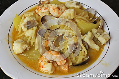 Fish stew with prawns and clams