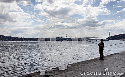 Fisher in Kurucesme / Arnavutkoy area of Istanbul. Editorial Stock Photo