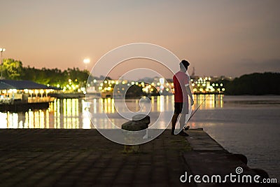 Fisher at Pier Editorial Stock Photo