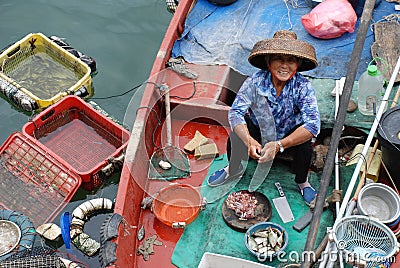 Chinese fisher woman on the boat Editorial Stock Photo