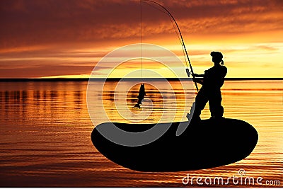 Fisher woman into a fishing boat with catching fis Stock Photo