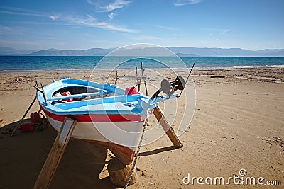 Fisherboat before tourist season at Kavos beach in Corfu, Greece Stock Photo