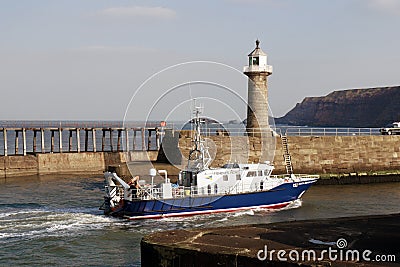 Fisheries Patrol boat entering Whitby harbour Editorial Stock Photo