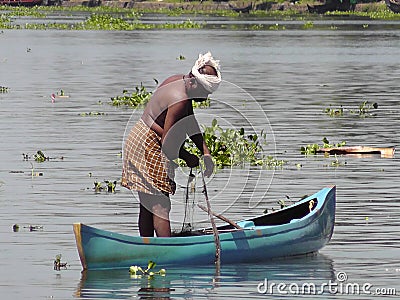 Fisherman in alleppey backwaters of Kerala Editorial Stock Photo