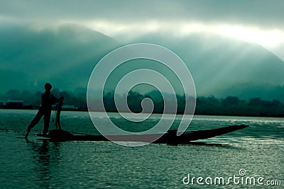 Fisherman in boat Stock Photo