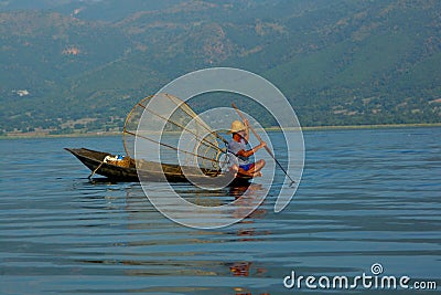 Fisherman in boat Stock Photo