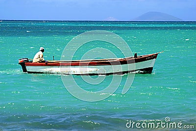 Fisherman in a boat Stock Photo