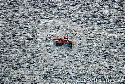 Fisherman boat in the meadle of the ocean Editorial Stock Photo