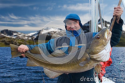 Fisherman on boat near Lofoten island Stock Photo