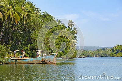 Fisherman boat on the river Chapora Editorial Stock Photo