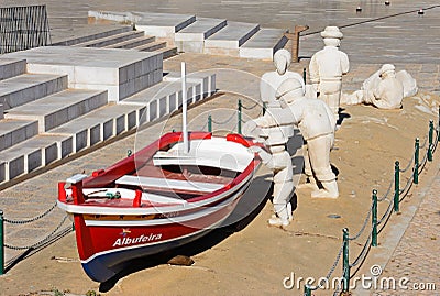 Fisherman and boat statue, Albufeira. Editorial Stock Photo