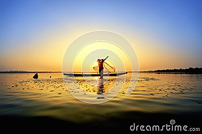 The fisherman cast a boat on his boat Stock Photo