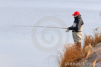 Fisherman catch a pike Stock Photo