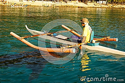 Fisherman feeds a whale shark Editorial Stock Photo