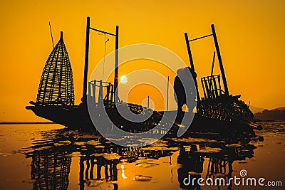 Fishermen fishing in the morning golden light,fisherman fishing in the river,Thailand,Vietnam,myanmar,Laos Stock Photo