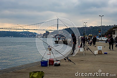 fisherman fishes on Bosphorus Istanbul on a Foggy sunrise Editorial Stock Photo