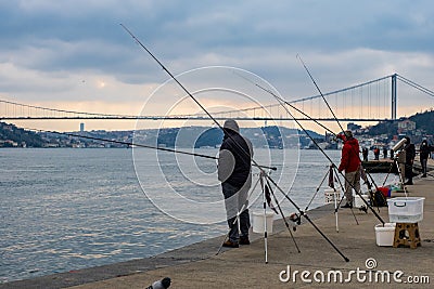 fisherman fishes on Bosphorus Istanbul on a Foggy sunrise Editorial Stock Photo