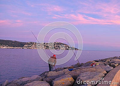 Fisherman fishes from a pier in the bay Editorial Stock Photo