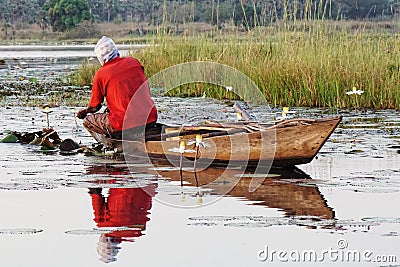 Fisherman in a boat on lake tengrela in burkina faso, africa Stock Photo