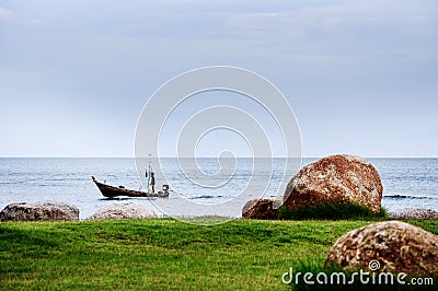 A Fisherman on his Boat Sailing in the Ocean Stock Photo