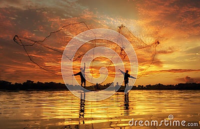 Fisherman of Lake in action when fishing Stock Photo