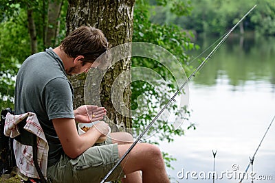 Fisherman preparing lure, fishing getaway hobby concept Stock Photo