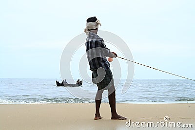 Fisherman pulls his fishing boat Editorial Stock Photo