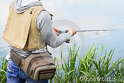 Fisherman on the river bank Stock Photo