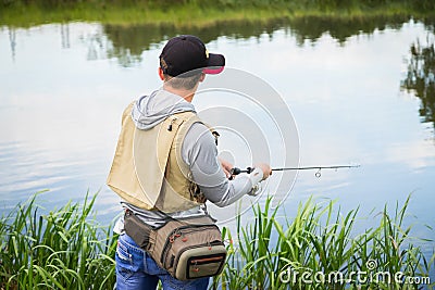 Fisherman on the river bank Stock Photo