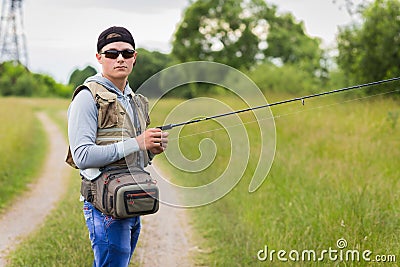 Fisherman on the river bank Stock Photo