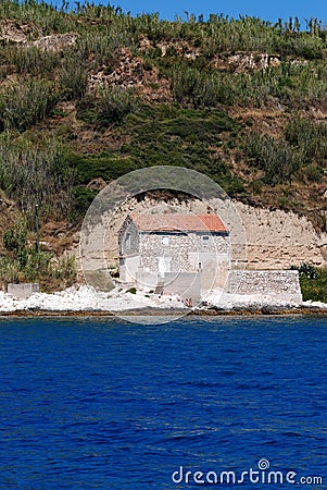 Fisherman's house at the rocky stone beach in island Susak,Croatia Stock Photo