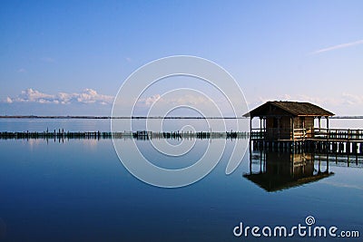 Blue reflection of a fisherman`s hut Stock Photo