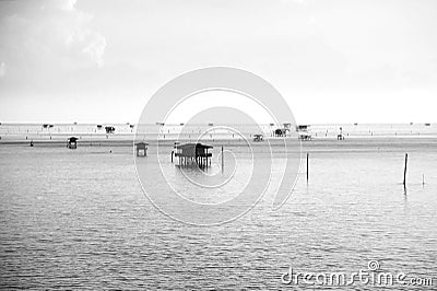 Fisherman`s huts in the blue sea, black and white style Stock Photo