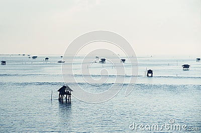 Fisherman`s huts in the blue sea Stock Photo