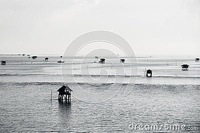 Fisherman`s huts in the blue sea Stock Photo