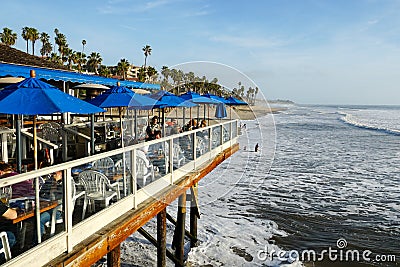 Fisherman`s restaurant on San Clemente Pier with beach and coastline on background. Stock Photo