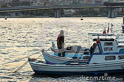 Fisherman Standing on the bow Editorial Stock Photo