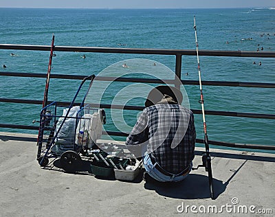 Fisherman swimmers pier ocean Editorial Stock Photo