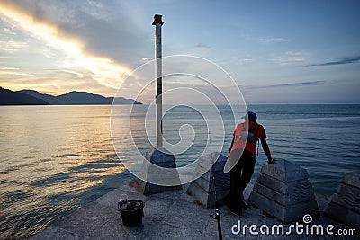 Fisherman Taking a Break in Batu Ferringhi Editorial Stock Photo