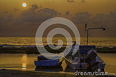 Fishermen boat at the small port of Givat Olga Hadera Israel in sunset Stock Photo