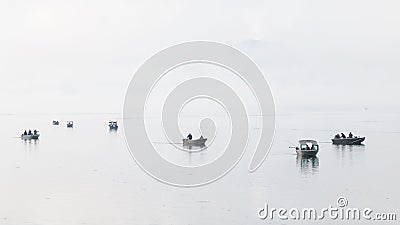 Fishermen in fall on the calm misty water of Tillamook Bay in Oregon Editorial Stock Photo