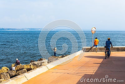 Fishermen fishing in Oeiras, Portugal Editorial Stock Photo